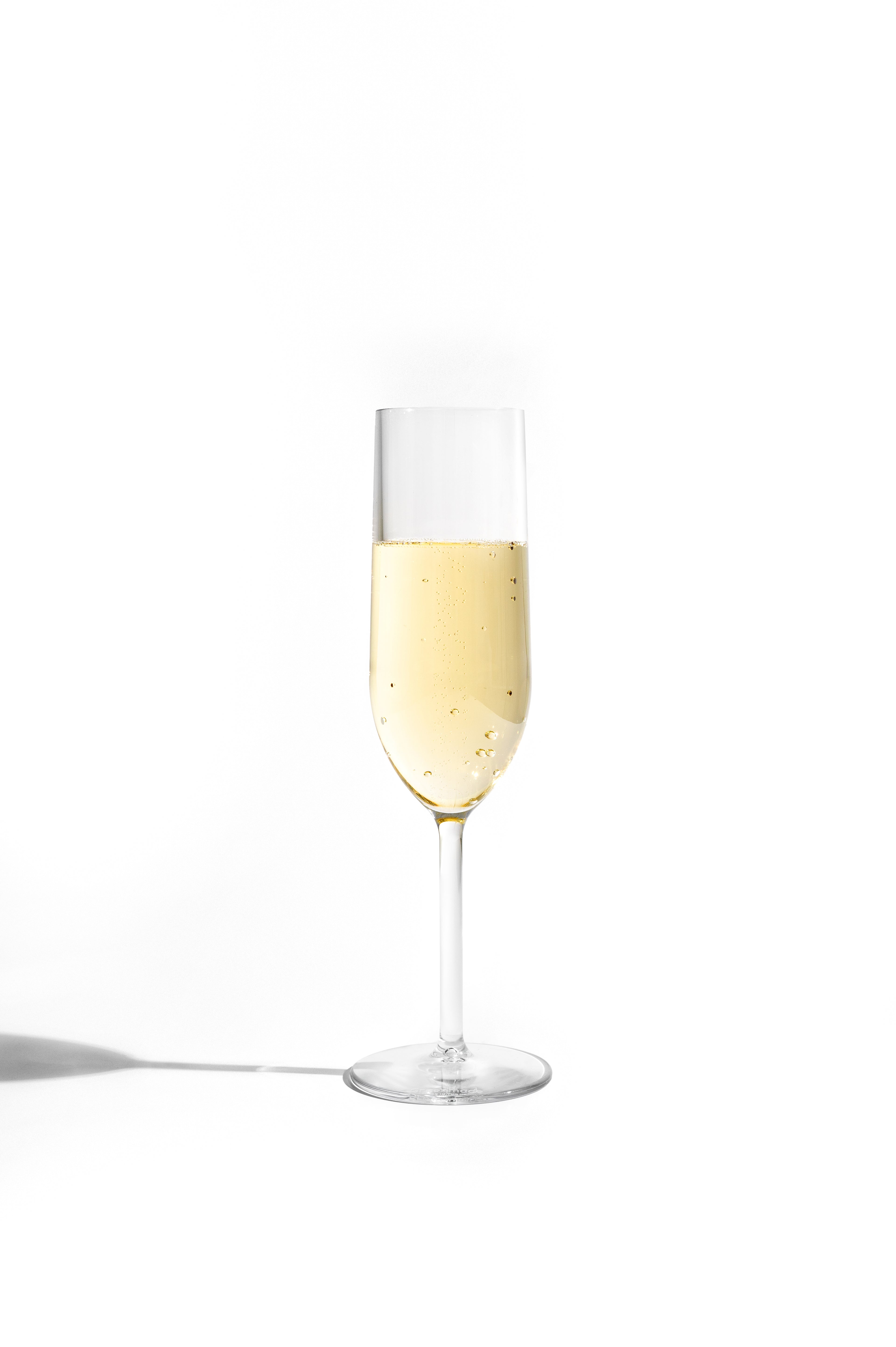Champagne flute with champagne on a white background