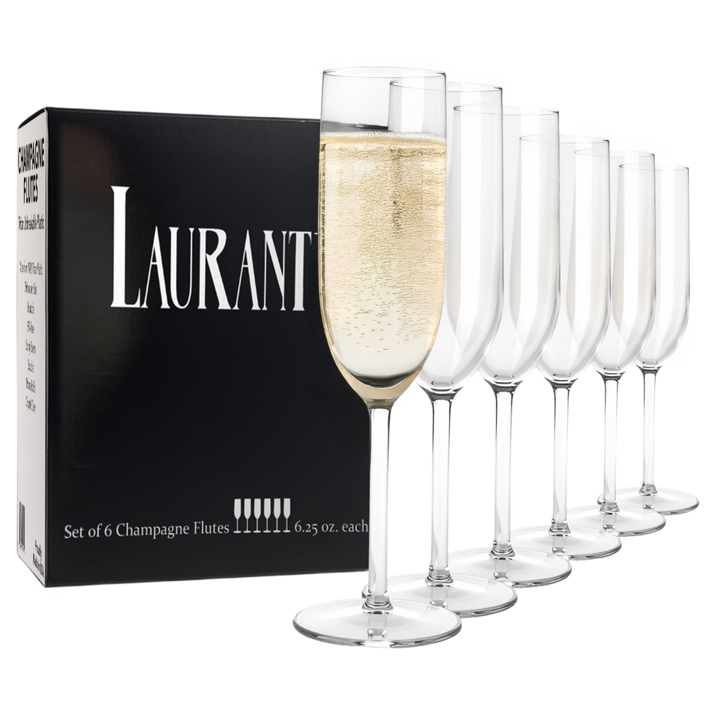 Set of 6 champagne flutes with one filled with champagne next to their packaging box.